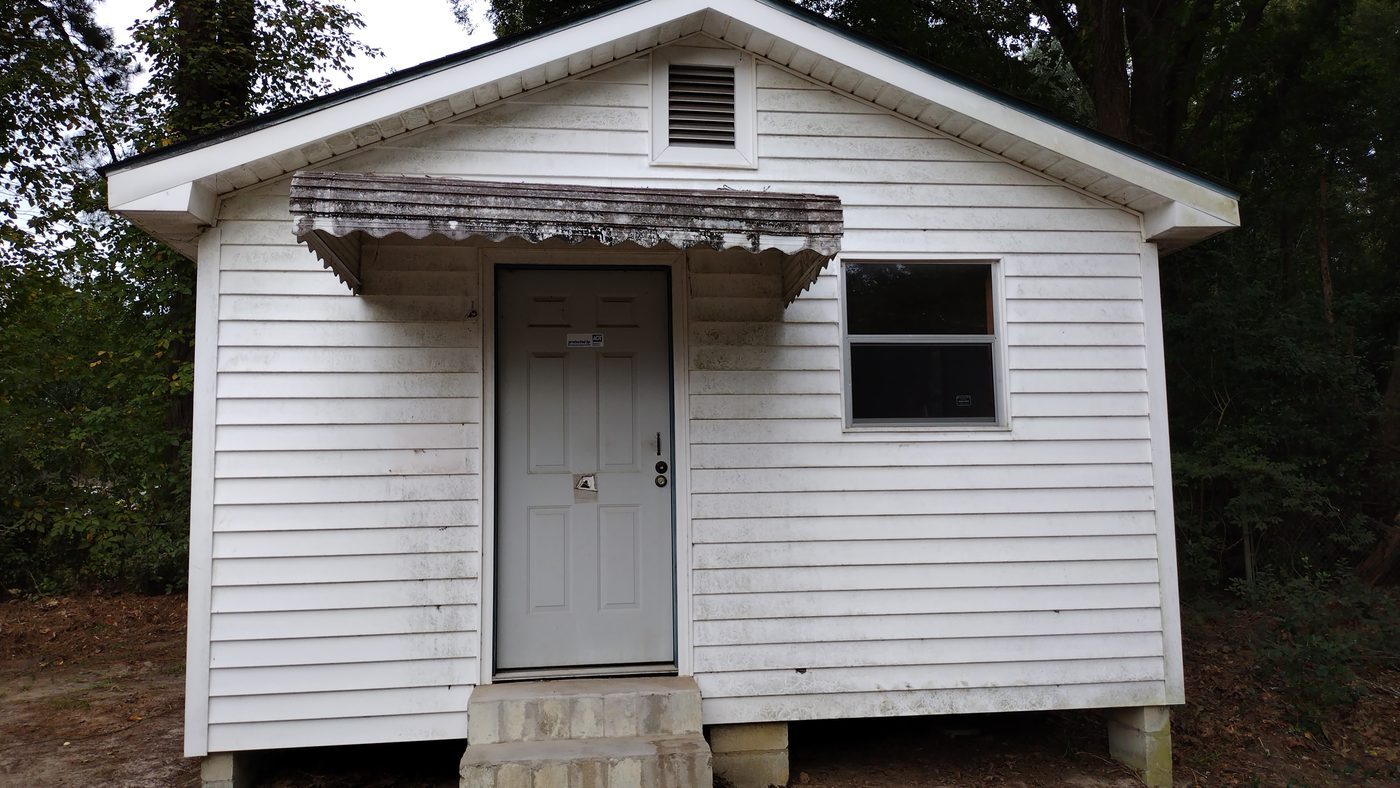 A small older house bought as-is, with no repairs required from the seller